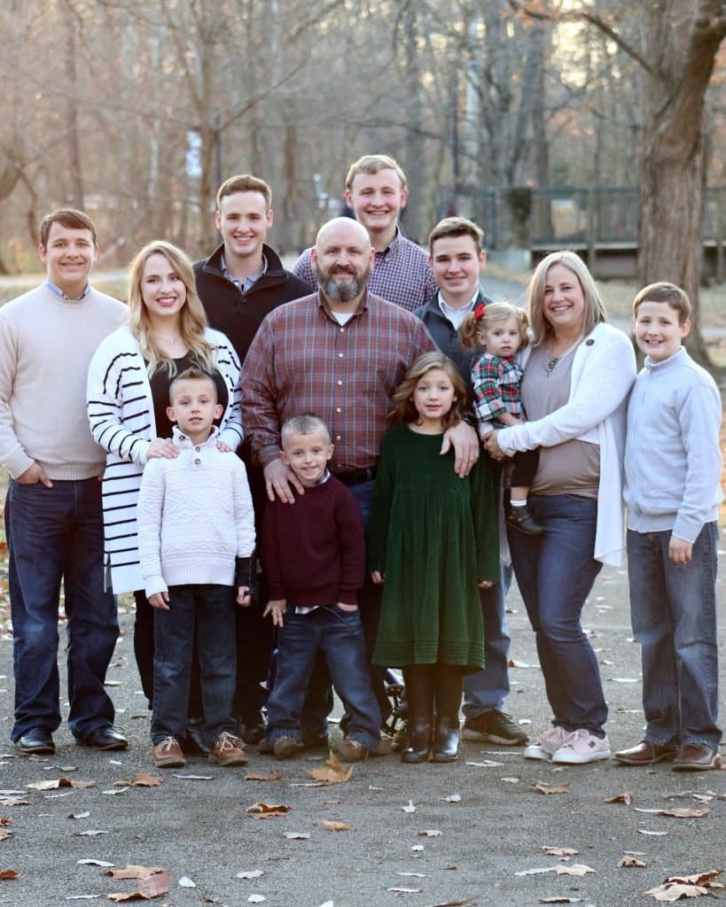 Elizabeth and the Cavanaugh family together outdoors